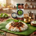 Gongura Pickle served on hot steaming rice on banana leaf — traditional Andhra style