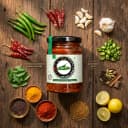 Fresh ingredients for Andhra Store Green Chilli Pickle — red chillies, garlic, curry leaves and whole spices