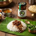 Karela Pickle served on hot steaming rice on banana leaf — traditional Andhra style