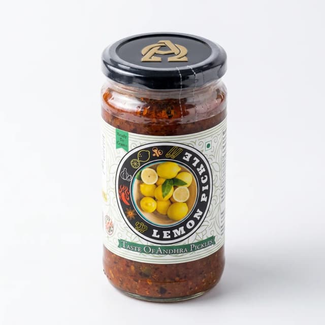 Lemon Pickle — Andhra Store sealed glass jar on white background, hygienically packed