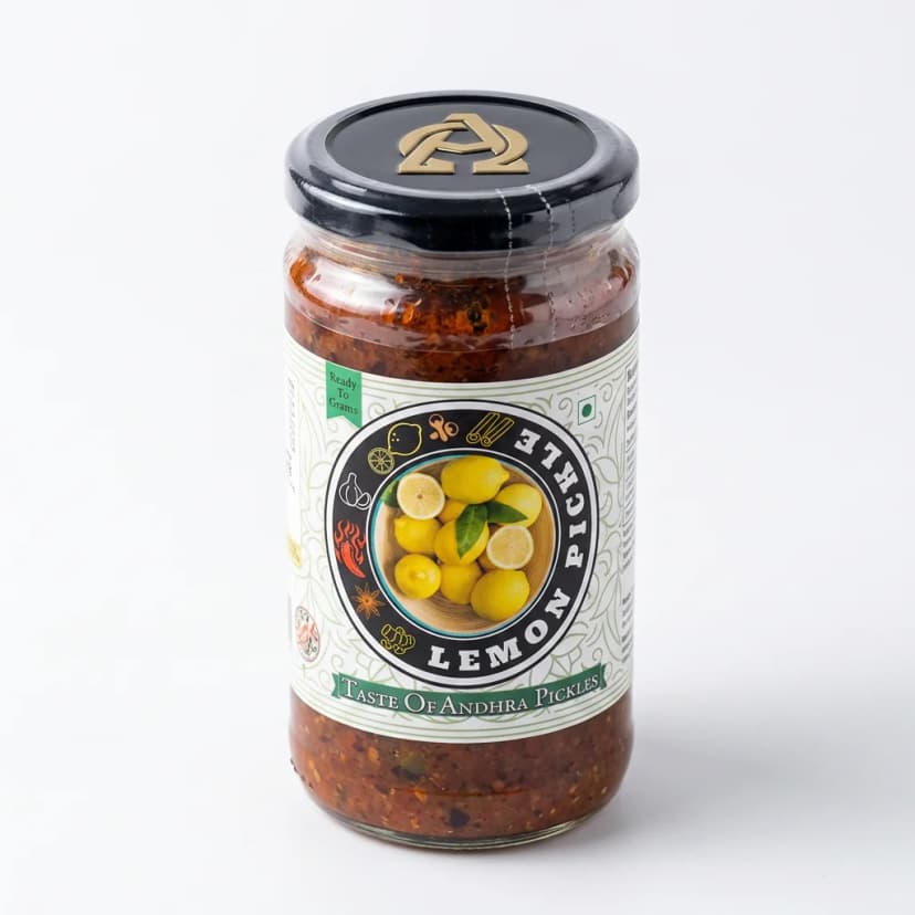Lemon Pickle — Andhra Store sealed glass jar on white background, hygienically packed