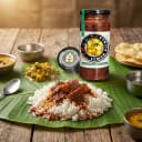 Lemon Pickle served on hot steaming rice on banana leaf — traditional Andhra style