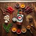 Fresh ingredients for Andhra Store Red Chilli Pickle — red chillies, garlic, curry leaves and whole spices