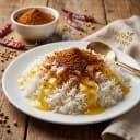 reddish-brown sesame spice serving suggestion — South Indian breakfast or meal with ghee