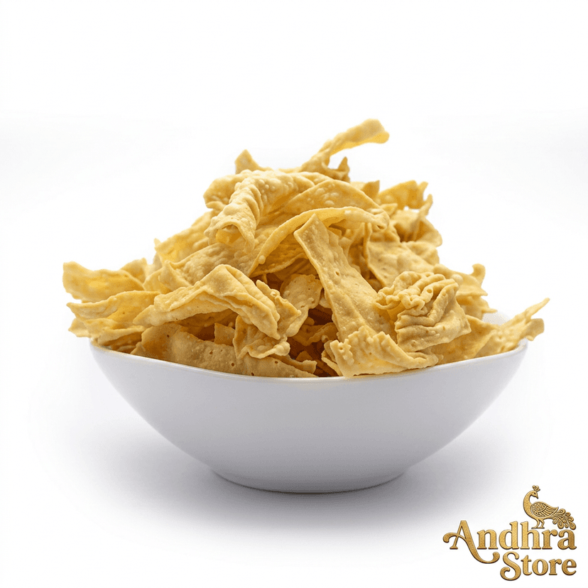 Fafda — crispy golden gram flour strips on white background